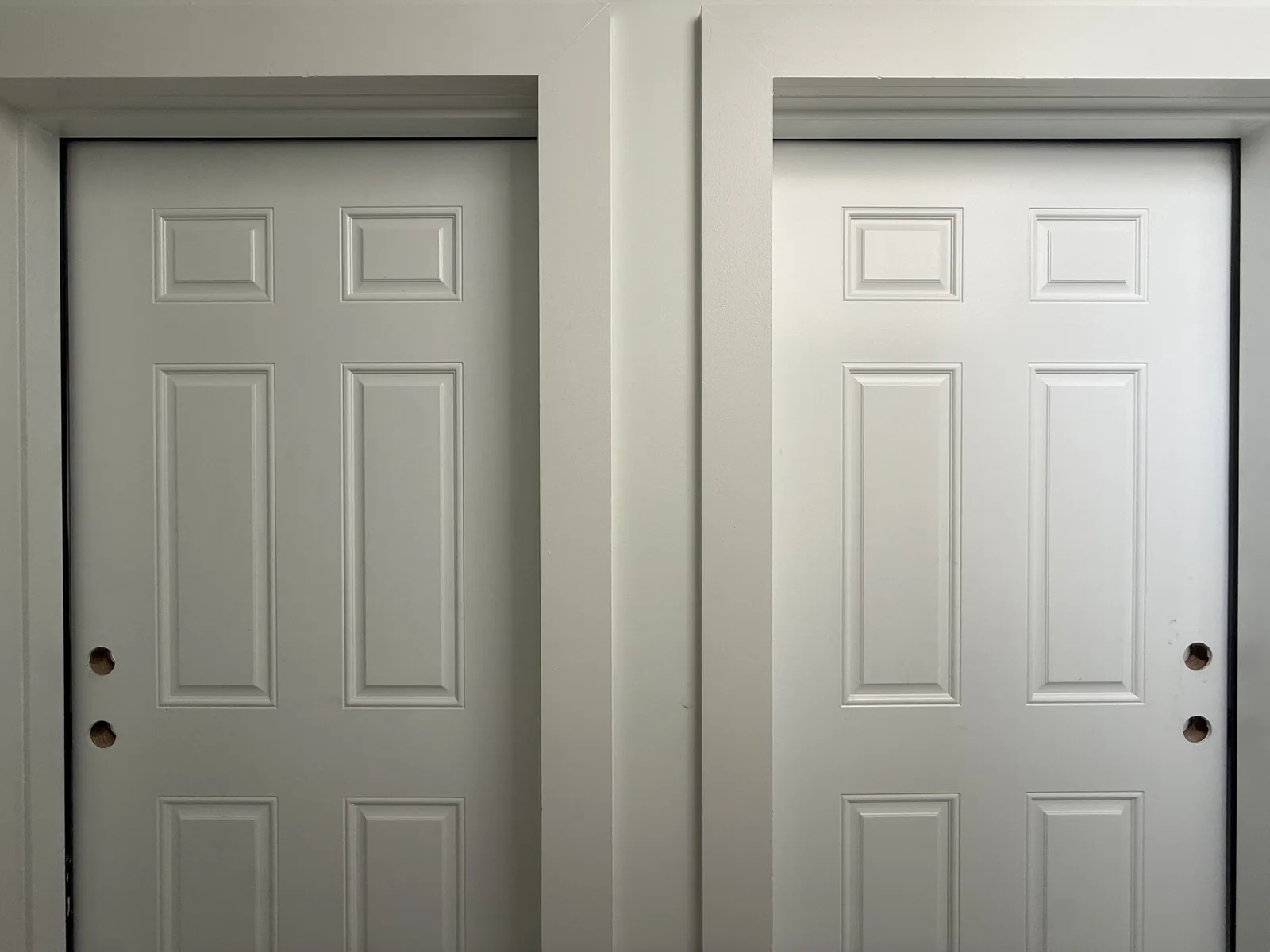 Doors to Unit 2 and Unit 3 from the rear hallway
